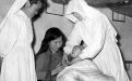 Two Sisters helping a mother with her baby in China