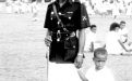 Fijian policeman with a young boy