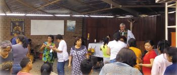 Columban Fr. Ed O'Connell and parishioners before Mass