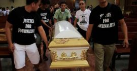 Filipino journalists escort the coffin of slain news reporter Alex Balcoba during his funeral in metro Manila, Philippines June 1, 2016.