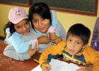 A volunteer works with children and the center